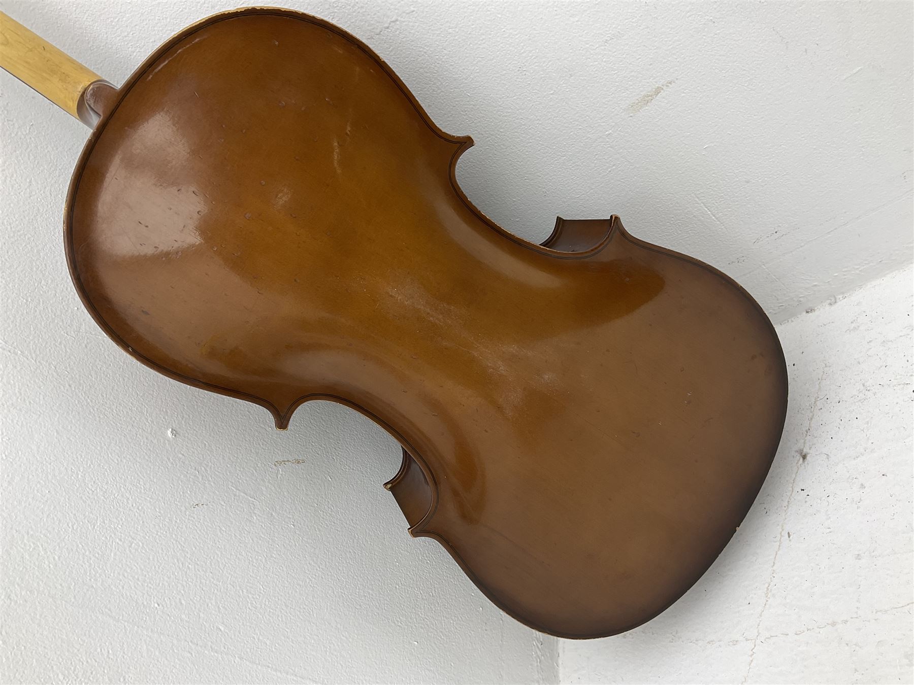 Modern Romanian student's three-quarter size cello with 70cm two-piece maple back and ribs and spruce top, bears label 'Musikinstrumentenfabrik Reghin Romania' L115cm overall