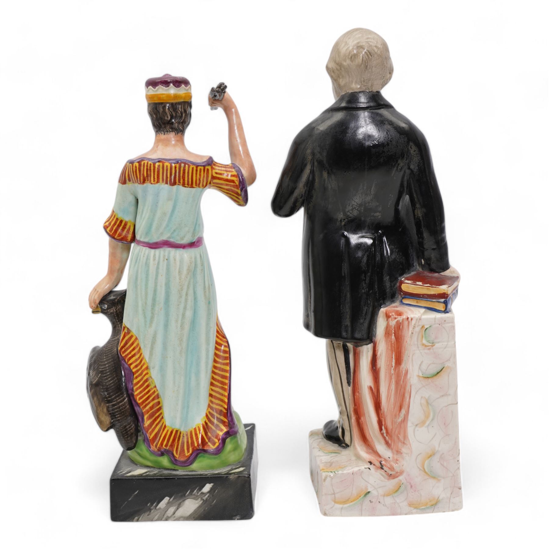 19th Century Staffordshire pearlware figure modelled as Jupiter stood beside a raven, stood upon a faux marble base, painted in bright polychrome enamels, H28cm together with a Staffordshire figure of William Ewart Gladstone (2)