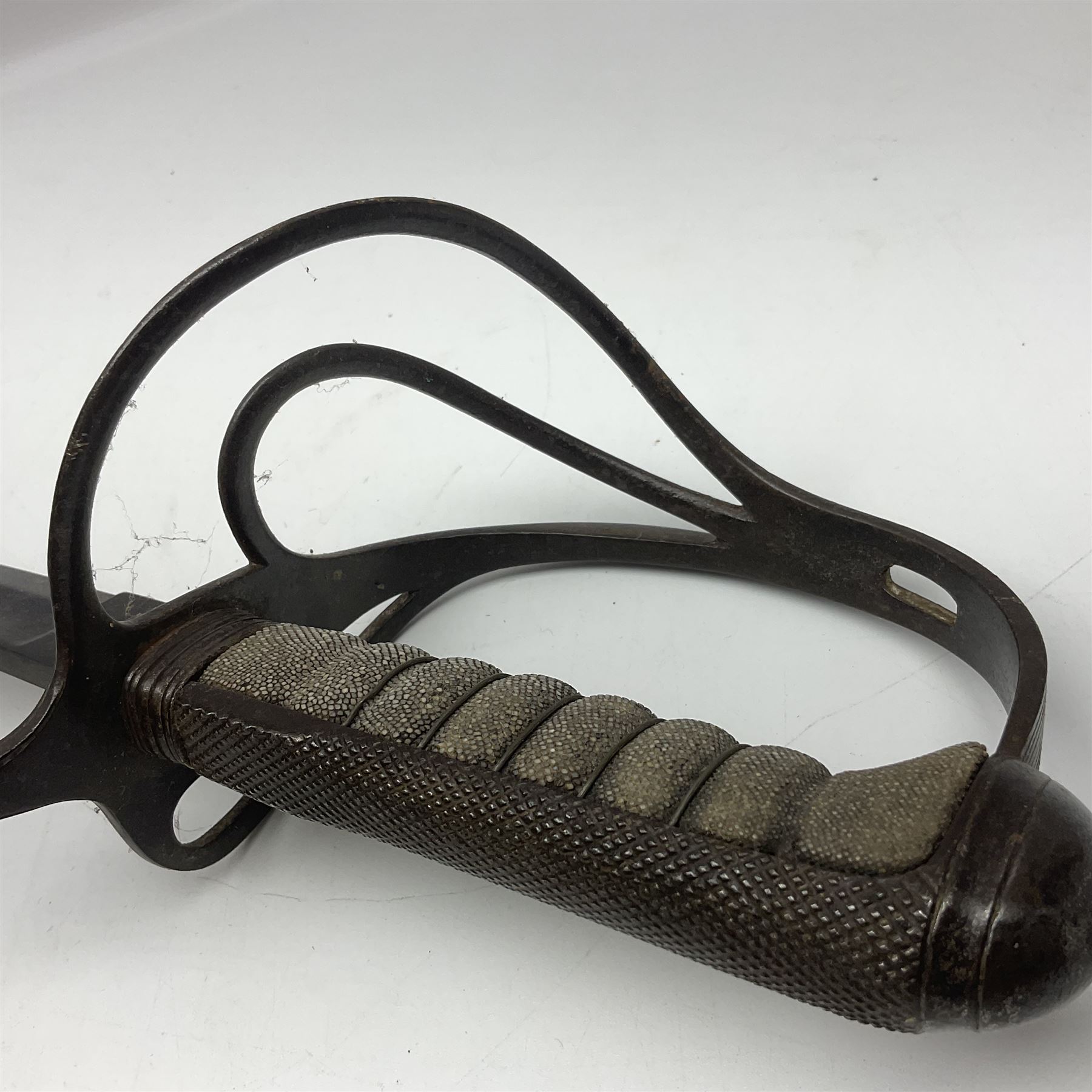 WW1 British Army 1897 Pattern Officers Sword, the 80cm fullered steel blade with traces of decoration and inscribed 'W.E. French 1914'; the basket hilt pierced with the George V cypher and wire-bound fish-skin grip L97cm overall; and WW1 British 1821 pattern Royal Artillery officer's sword with three-bar hilt; both lacking scabbard (2)