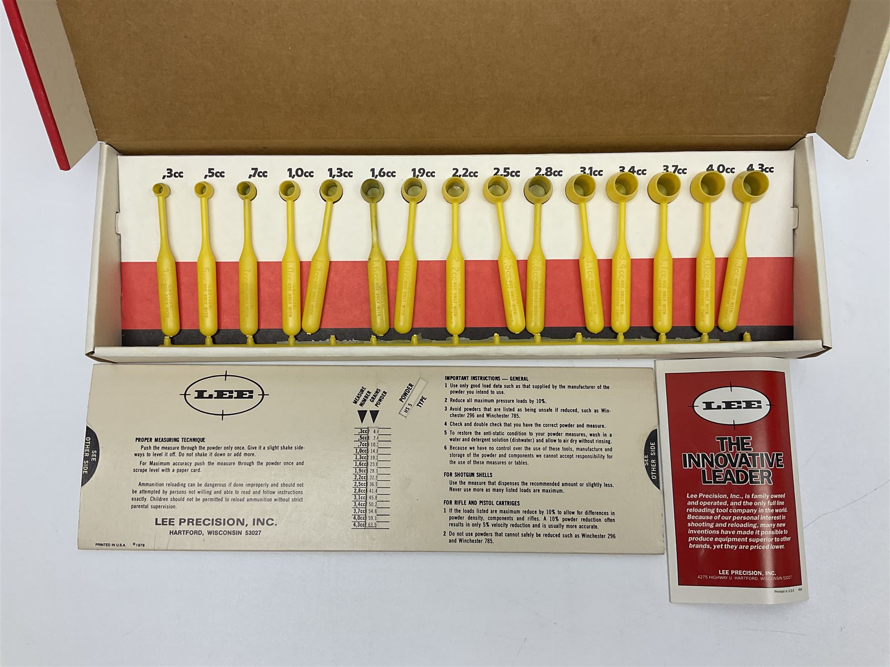 RCBS single station loading press with shell holder and powder funnel; and boxed Lee Powder Measure Kit
