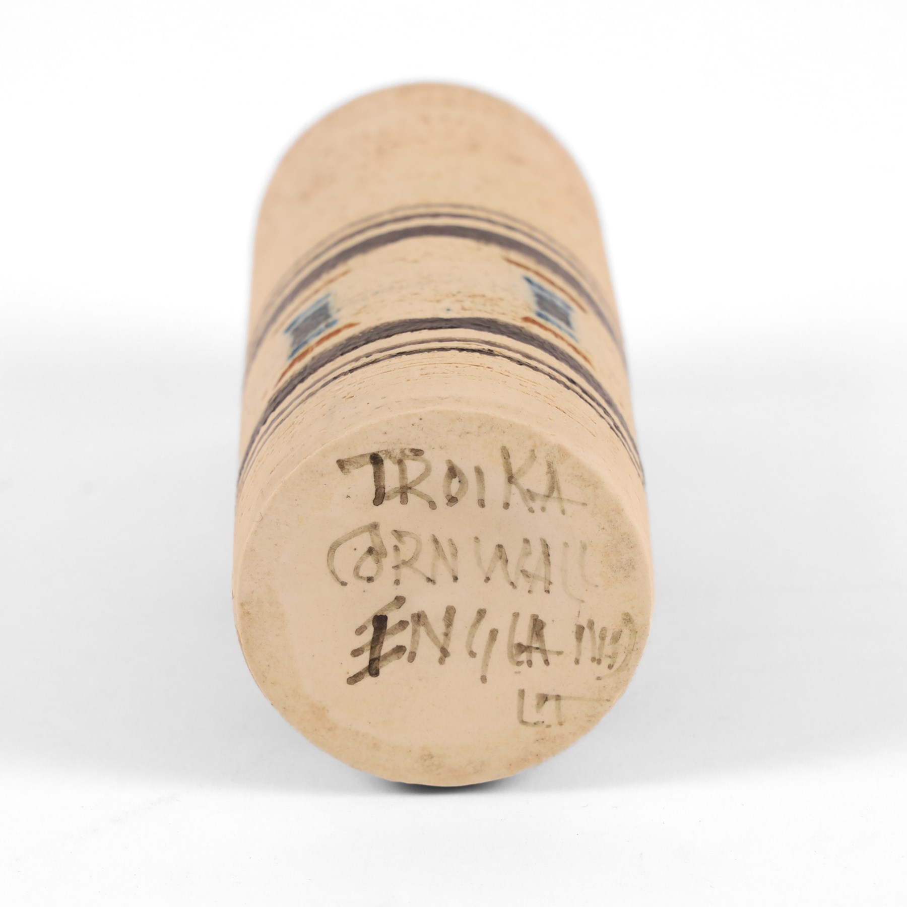 Troika cylindrical vase decorated with circles upon a striped backdrop, designed by Linda Taylor, with painted marks beneath, H14cm