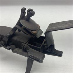 Late 18th/early 19th century flintlock tinder lighter, the steel box lock with hinged door to the left side, fruitwood butt with plain bar trigger, the left side set with a taper sconce and bipod front support, L21cm.