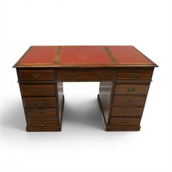 Late 19th century twin-pedestal desk, red leather inset top over an assortment of eleven drawers, on plinth base (W126cm D65cm H77cm); with Edwardian oak framed Captains swivel desk chair, of tub shaped form with spindle back supports (W60cm H89cm)