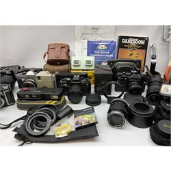 Vintage and later cameras, lenses, accessories and darkroom equipment including Zenit 12XP camera, Praktica BX20 camera fitted with 'Sigma Zoom Master 1:3.5-4.5 f=35-70mm' lens, Praktica LLC camera fitted with 'Carl Zeiss Jena Pancolar 1.8/50' lens, Canon Zoom Lens 'EF 100-300mm 1:5.6', various Jessop and other makers darkroom items including safelight (Red), universal duo tank, multi-mask enlarging easel etc, in three boxes