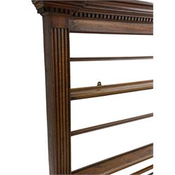 George III oak dresser, projecting dentil cornice over three heights plate rack enclosed by fluted uprights, the dresser fitted with five drawers and two panelled cupboards, canted corners with fluted quarter columns, on bracket feet