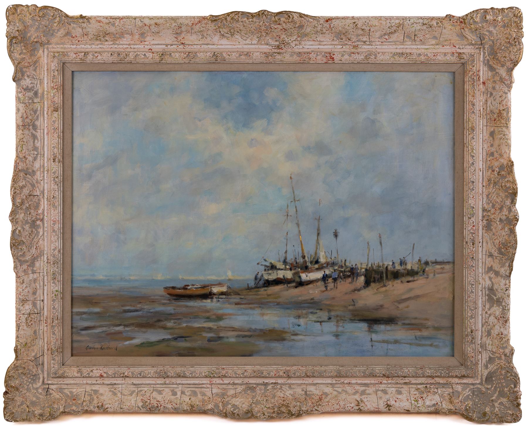 Gordon Radford (British 1936-2015): 'Figures and Beached Vessels on a Sandy Stretch', oil on board signed, titled verso 45cm x 60cm