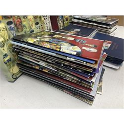 Moorcroft, 1897-1993 revised edition; an illustrated guide to Moorcroft Pottery, a hard back book by Paul Atterbury, together with a quantity of Moorcroft Collector's Club magazines