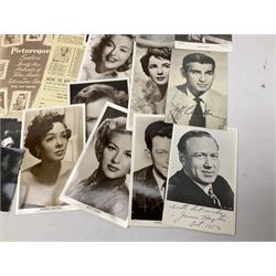 Approximately sixty portraits of mid-20th century film stars and entertainers, some bearing original or printed signatures - various pin-ups including Marilyn Monroe, Gina Lollobrigida, Joan Collins, Sabrina, Elizabeth Taylor etc, Tony Curtis, Dana Andrews, Marlon Brando, Alan Ladd etc; and a small four-drawer filing chest containing a quantity of film cells made into photographic slides