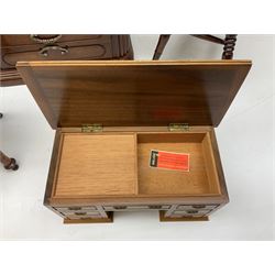 Quantity of miniature furniture to include elm stool supported by four turned legs, walnut kneehole desk, saddleback chair, table top fruitwood chest of drawers etc