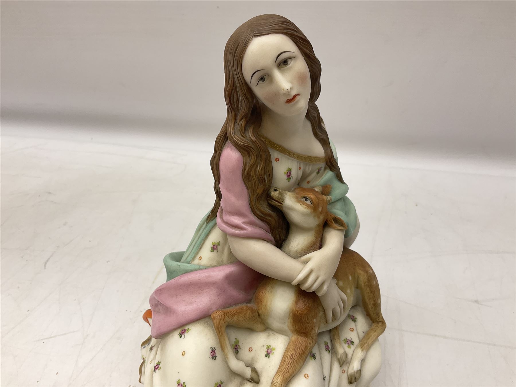 Hummel figure of a praying Saint together with a figure of a seated girl with deer, largest H40cm (2)