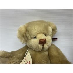 Group of five teddy bears comprising ‘George’ a unique pellet filled bear with glass eyes and velvet paws H38cm, and ‘Abbey’ a luxury German plush with wobble head and glass eyes no.5/10 H24cm, both with Teddies from Bearyland labels; along with two light blonde mohair H. M. Bears and Boyds Bears ‘T. F. Wuzzies’ no. 595140 (5)