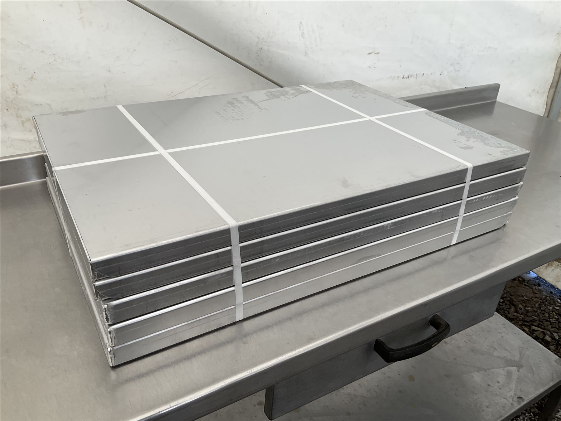 Ten aluminium three sided baking trays - NEW unused, 66cm x 46cm - THIS LOT IS TO BE COLLECTED BY APPOINTMENT FROM DUGGLEBY STORAGE, GREAT HILL, EASTFIELD, SCARBOROUGH, YO11 3TX