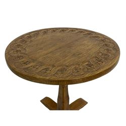 Gnomeman - oak coffee table, circular top with guilloche carved band, on square chamfered pillar support carved with gnome signature and cruciform base, by Thomas Whittaker, Littlebeck