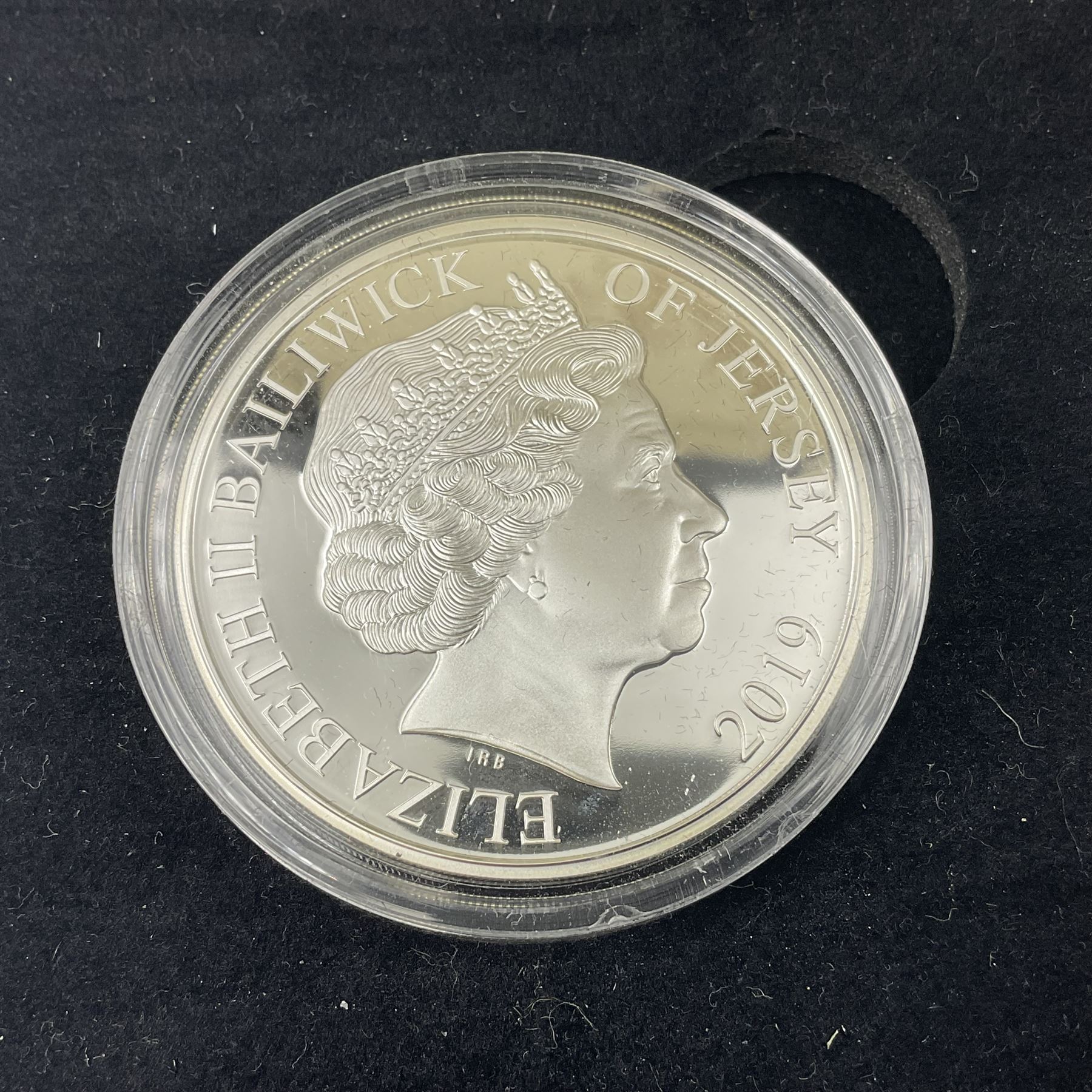 King Charles III 2023 'Coronation Silver Proof Mint Masters Set' comprising Bailiwick of Jersey, Bailiwick of Guernsey and Isle of Man sterling silver proof five pound coins, cased with certificate and Queen Elizabeth II 2019 Bailiwick of Jersey 'Remember With Us' silver two pound and five pound pair, cased with CPM certificate