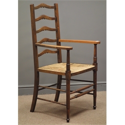  Early 20th century oak ladder back armchair, rush seat, turned supports  