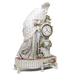 Large19th century  German porcelain mantel clock with white dial and striking movement, the case with a standing figure of Flora resting on a pillar with floral applied decoration, the base painted eith landscape and floral panels on paw feet H77cm W43cm