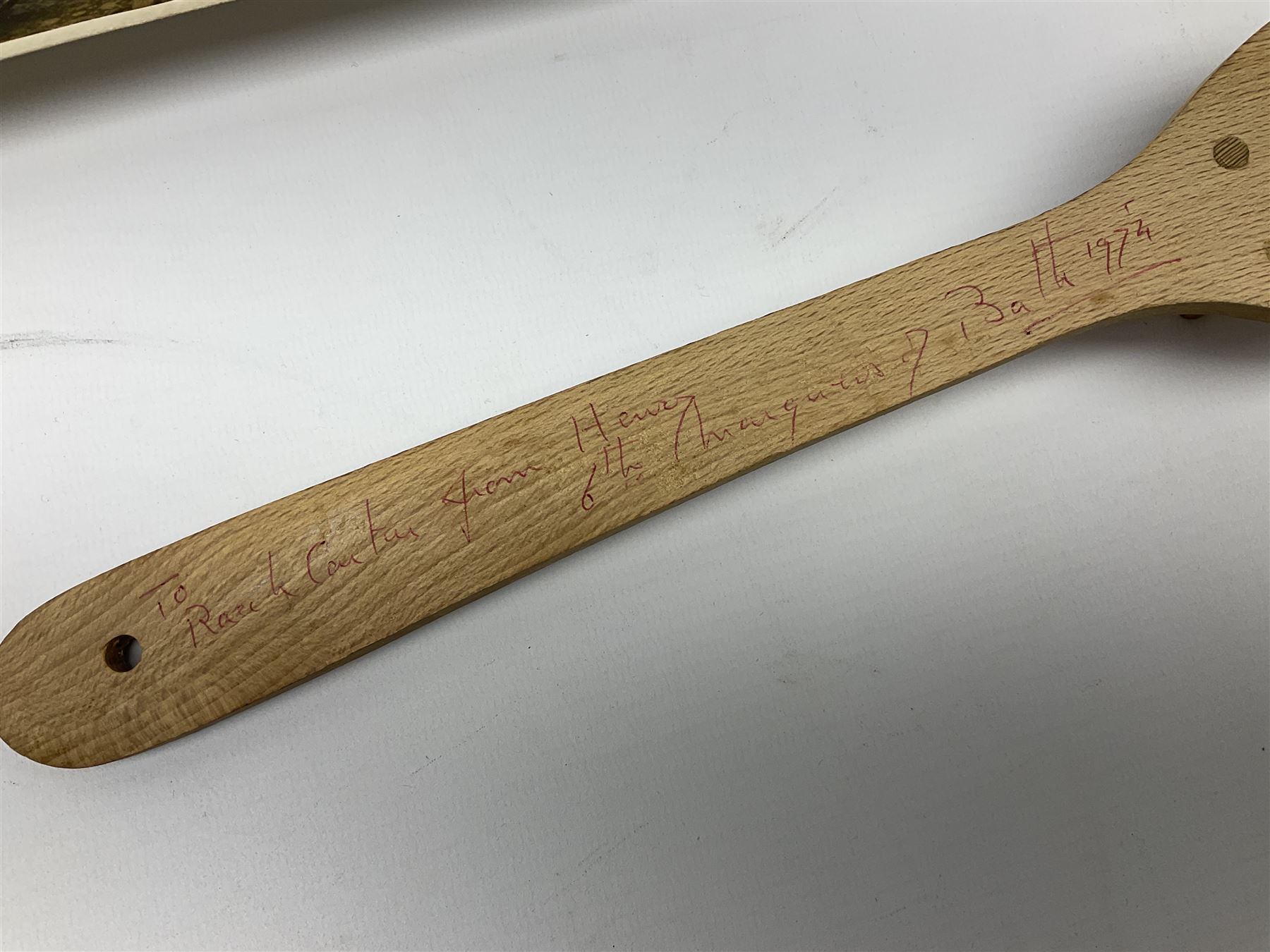 Early 1970s sepia photograph of the Pools Panel meeting at The Waldorf Hotel, London including Raich Carter, Marquis of Bath, Arthur Ellis, Neil Franklin etc 19 x 25cm; together with a beech spaghetti server with manuscript presentation inscription 'To Raich Carter from Henry 6th Marquis of Bath 1974'; Provenance: By direct descent from the family of Raich Carter having been consigned by his daughter Jane Carter (2)