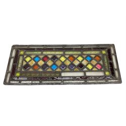 Stained glass and leaded rectangular window panel, with a Dimond pattern to the centre, H56cm, L22cm 