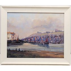 Colin Russell (British 1932-2009): Whitby Harbour with a view of the Abbey, oil on canvas signed 40cm x 50cm