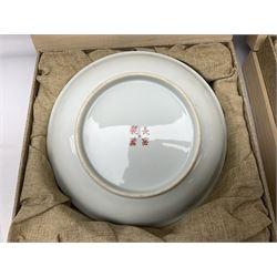 Three Chinese polychrome enamel plates each decorated with floral decoration, all marked beneath, D21cm 