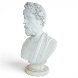Aristide Louis Fontana (Italian 1834-1907): Grand Tour marble bust of a Roman emperor, probably inspired by portraits of Marcus Aurelius, portrayed with finely carved curled hair and beard beneath a grapevine wreath with trailing vine leaves and clusters of fruit, the draped shoulders and truncated chest raised upon a turned circular socle, signed to the reverse, H61cm; together with the associated faux marble pedestal of rectangular form, H94cm
Provenance: Kirkham Hall