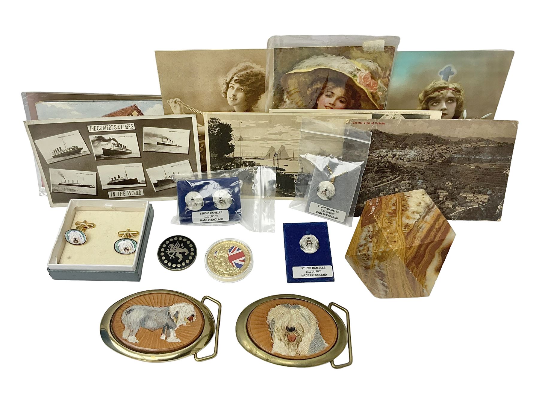 Studio Danielle Old English Sheepdog jewellery including two pairs of cufflinks, necklace and pin, together with similar belt buckle, hardstone tetradecahedron paperweight, postcards and an Imperial War Museum Falklands Conflict coin