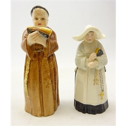  Two Victorian Royal Worcester candle snuffers as a monk standing holding an open Bible date code 1896 and a nun standing holding a Bible and rosary date code 1890 (2)  