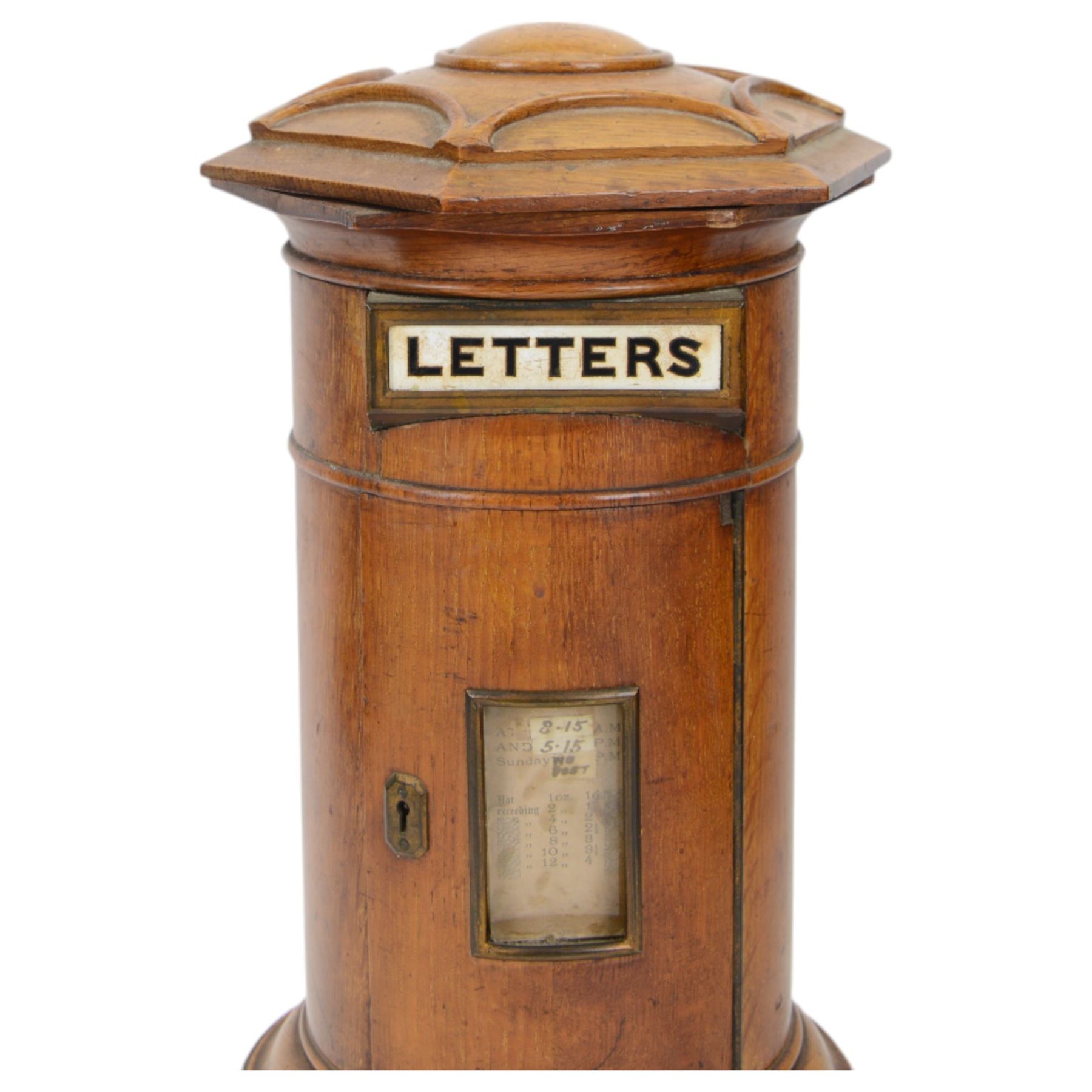 Victorian oak Country House domestic post box, of cylindrical form with hexagonal moulded domed top above a rectangular posting aperture detailed 'LETTERS', and hinged door with glazed aperture for posting times, upon a circular plinth with pull our drawer and canted drop handle, overall H43cm