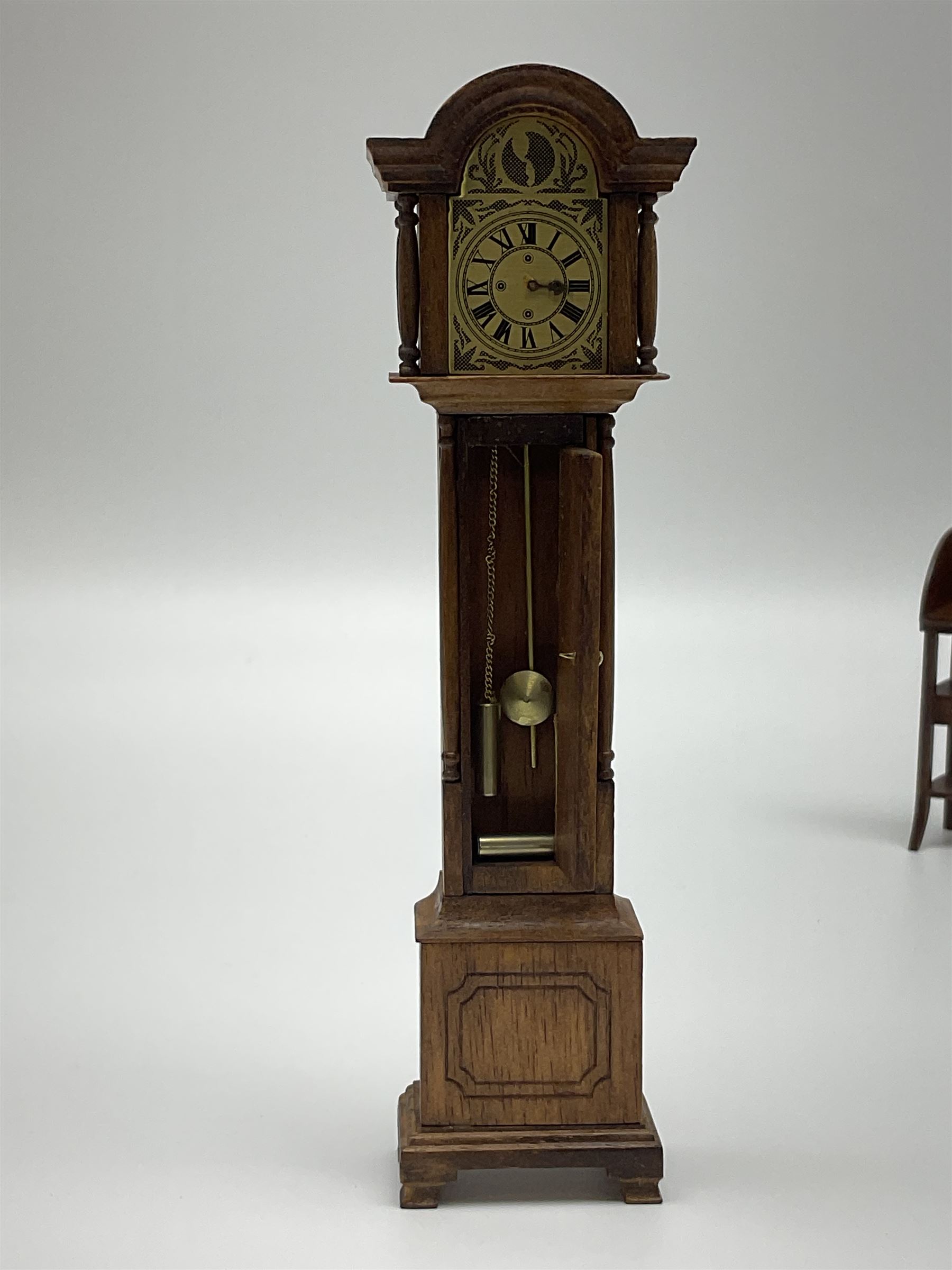 Collection of miniature dolls house furniture and accessories, to include long case clock, chest of drawers, tiled wash stand, ceramics and glass ware, mirror, baskets, etc 