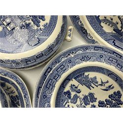 Wedgwood of Etruria blue and white willow patterned tea and dinner wares, to include lidded tureens, dinner plates, teacups, jugs etc