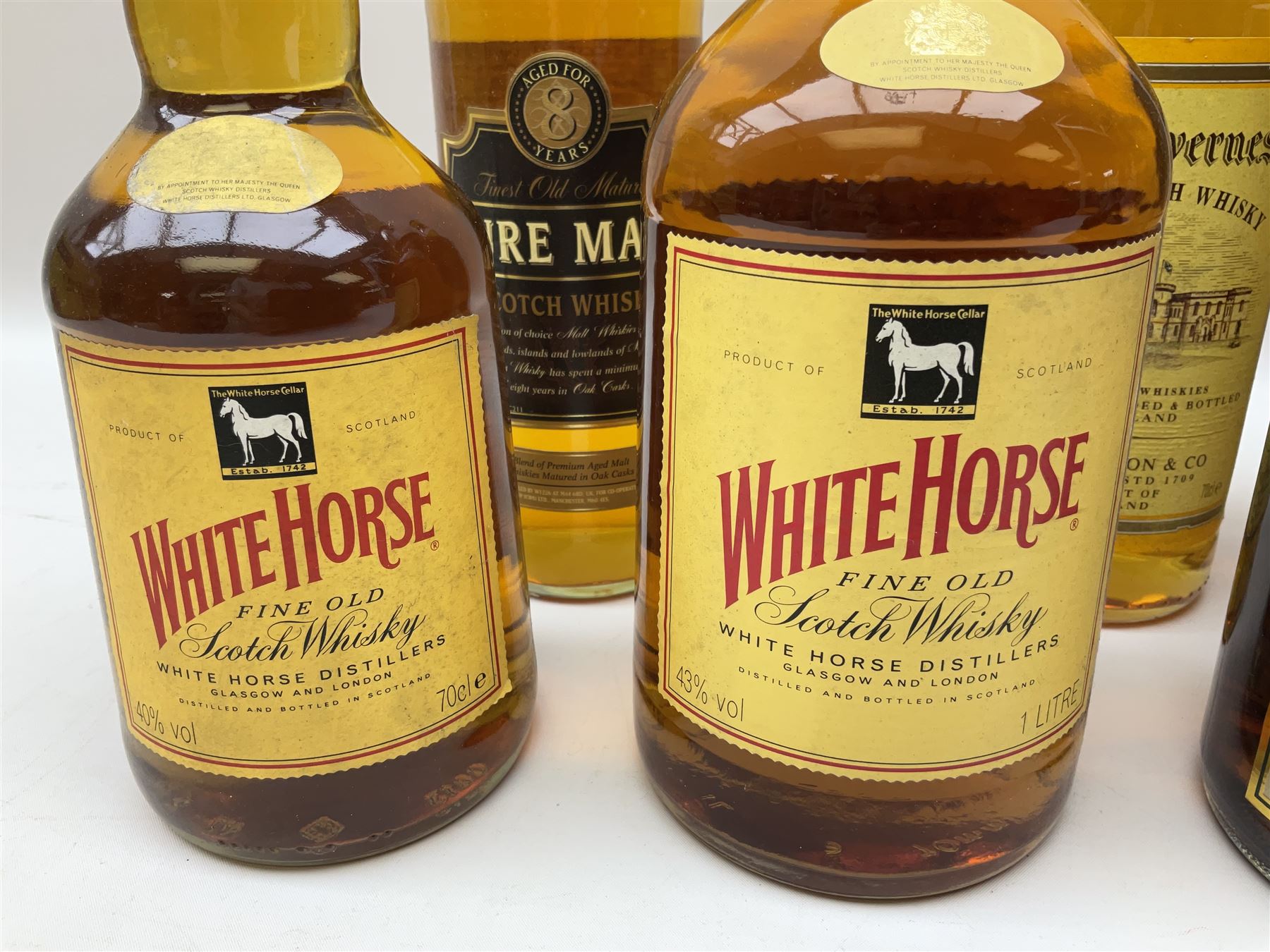 Mixed alcohol comprising Old Inverness Aged Scotch whisky, J.G.Thomson & Co, two bottles of White Horse Fine Old Scotch whisky, Three Barrels VSOP French Brandy in box etc, five bottles, various contents and proofs