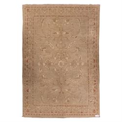 Afghan Ziegler hand-knotted carpet, soft ivory field woven with an elegant arrangement of ...