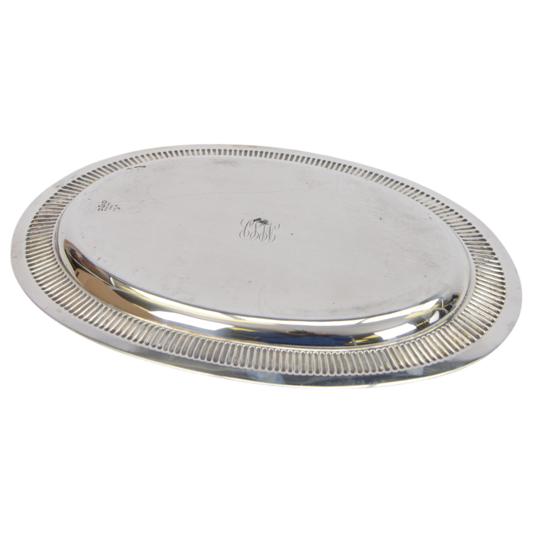American silver tray, of plain oval form with embossed rim engraved to underside with monogram, stamped Sterling with maker's marks for Gorham, W24cm, L36cm
