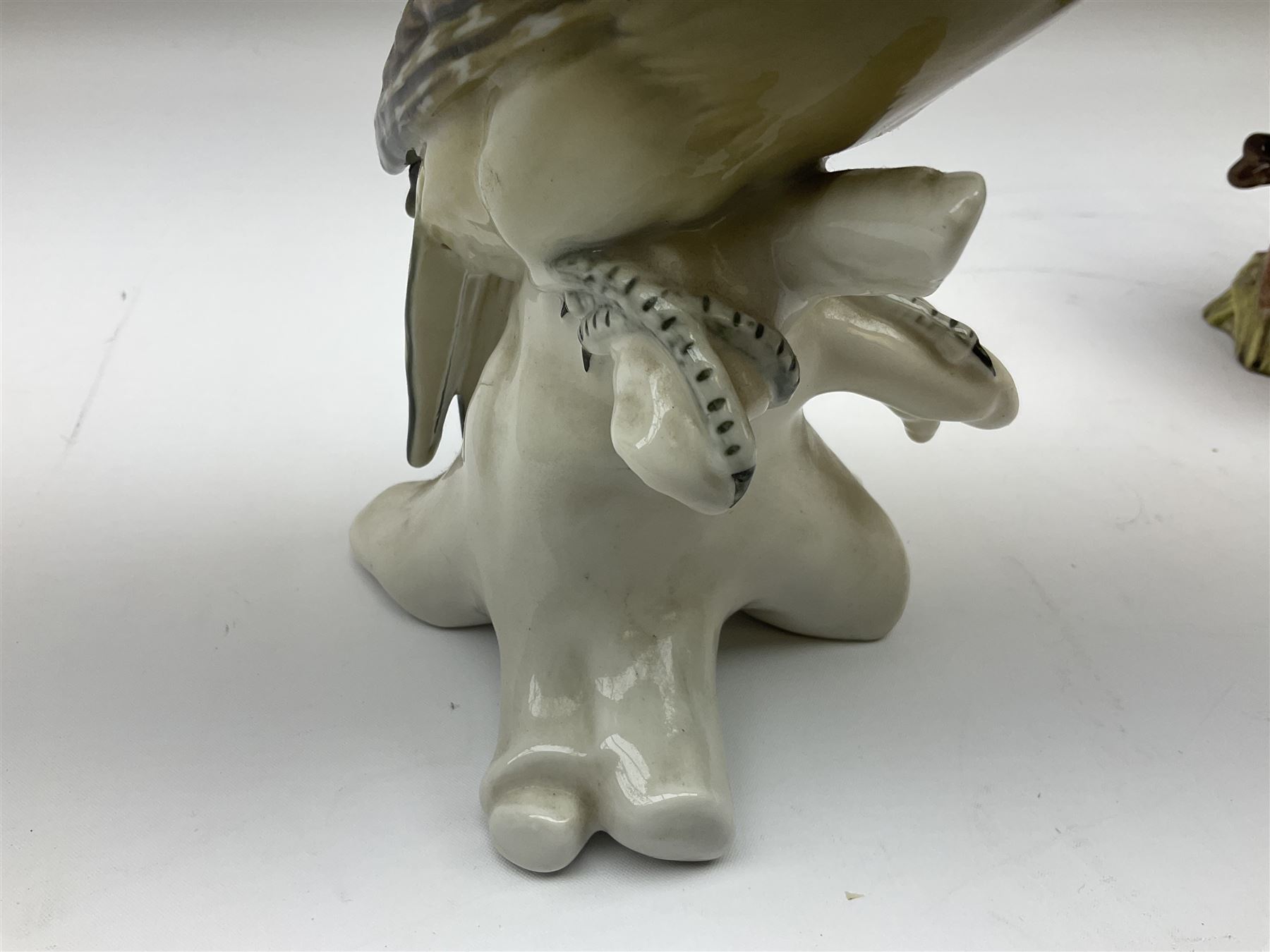 Karl Ens figure of a green woodpecker, modelled perched upon branch, model no. 7527, together with Karl Ens figure of budgie and Beswick Kingfisher no. 2371, all with printed marks beneath, tallest H25cm