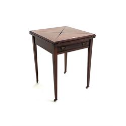 Edwardian envelope card table, inlaid baize top, four counter wells, stile supports and castors 