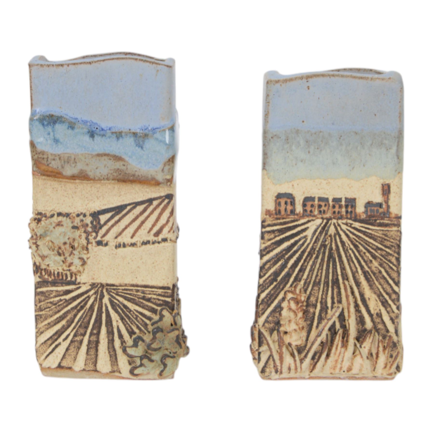 Robin Gough; two studio pottery vases of rectangular chimney vase, each decorated in relief with villages, H15cm 