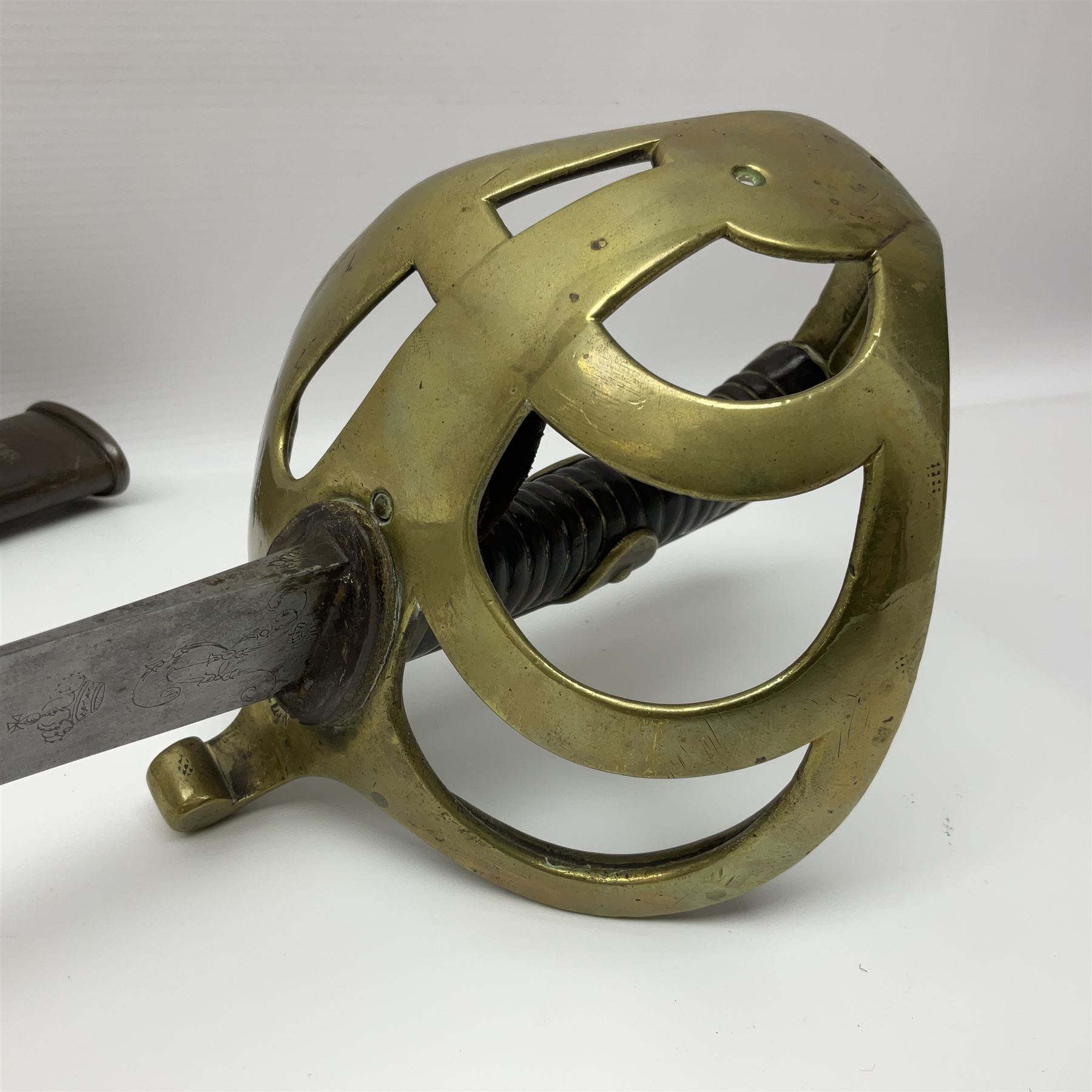 19th Century German (Saxony) Cavalry Sword, the 90.5cm single edge curved steel blade with narrow fuller to the back edge at each side, engraved with a crowned AR monogram and coat of arms, stamped with crowned AR, the back edge engraved C.v Keller im Solingen 1862, the brass half basket hilt with three flat curved bars, applied badge missing, marked G.R. 4, with ribbed leather covered grip and leather finger strap; in steel scabbard with two fixed suspension rings to one side and stamped G.R. II 118; L109.5cm overall