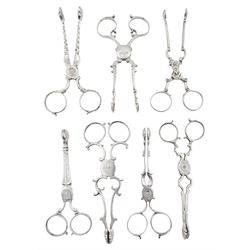 Collection of seven Georgian silver scissor action sugar nips, of various design and decoration including shell shaped bowls, scroll arms and bright cut engraved detail, various hallmarks, together with a Victorian silver example hallmarked Hilliard & Thomason, Birmingham, date letter indistinct, approximate gross weight 6.35 ozt (197.8 grams)

