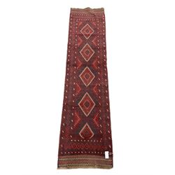 Meshwani red and blue ground runner, decorated with five lozenge medallions, overall geometric design