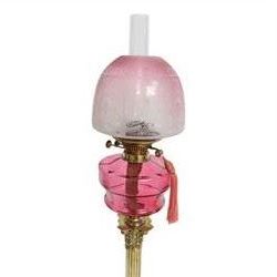 Victorian brass oil lamp, the Corinthian column supporting a cranberry glass burner and opaque etched cranberry glass shade and clear glass chimney, overall H77cm