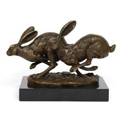 Bronze figure group, modelled two hares in chase, upon naturalistically modelled oval base signed Nick and with foundry mark, raised upon black marble base, H11cm L12.5cm