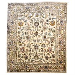 North East Persian Mashad hand-knotted carpet, ivory field decorated with an all-over scro...