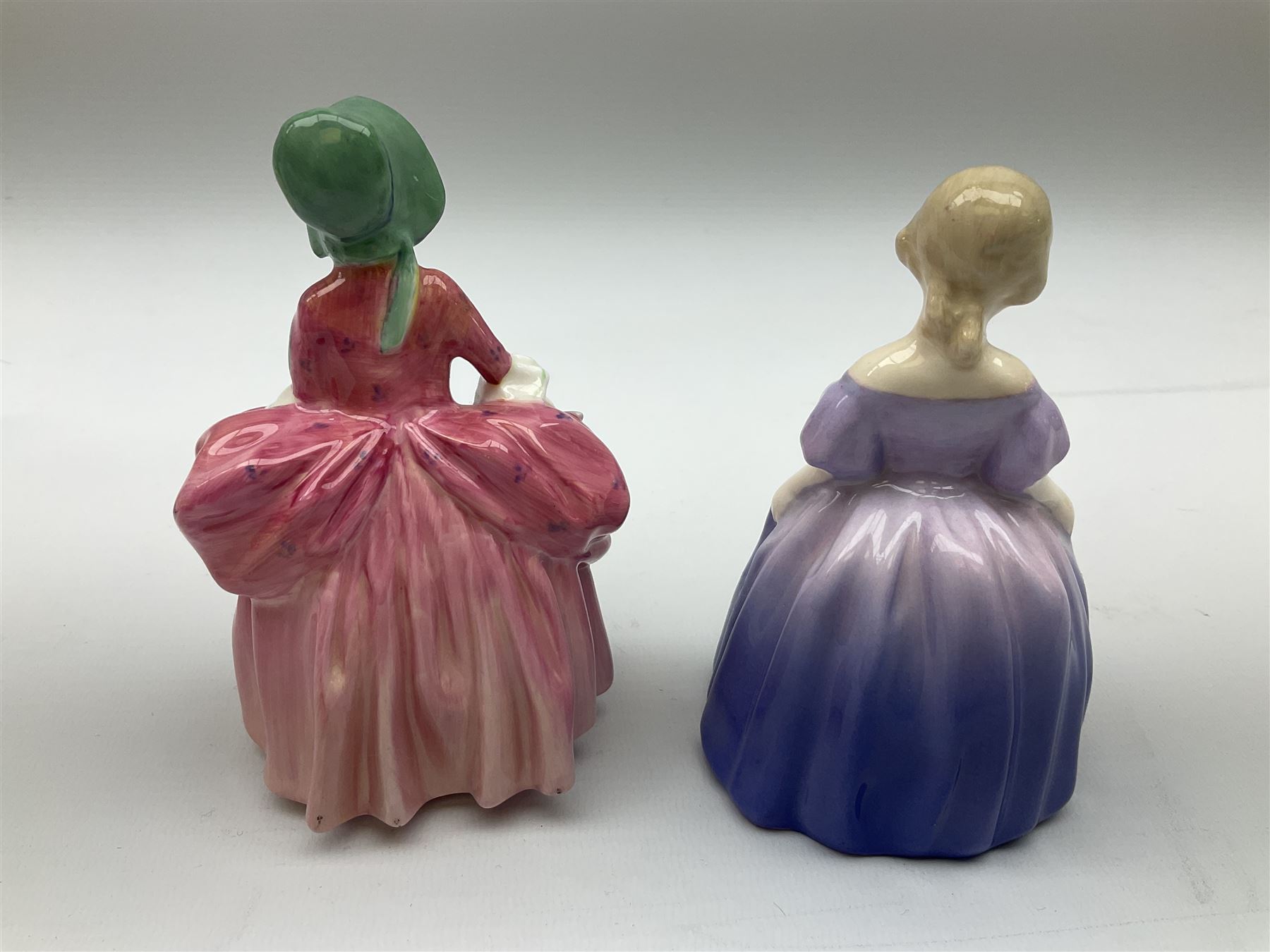 Group of figures, comprising six Royal Doulton examples, Daydreams HN1731, Silks and Ribbons HN2017, Tom Sawyer HN2926, Marie HN1370, Bo-Peep HN1811, and Tinkle Bell HN1677, together with a Dresden type 'lace' example, and a Coalport 'Swiss Cottage', (8)