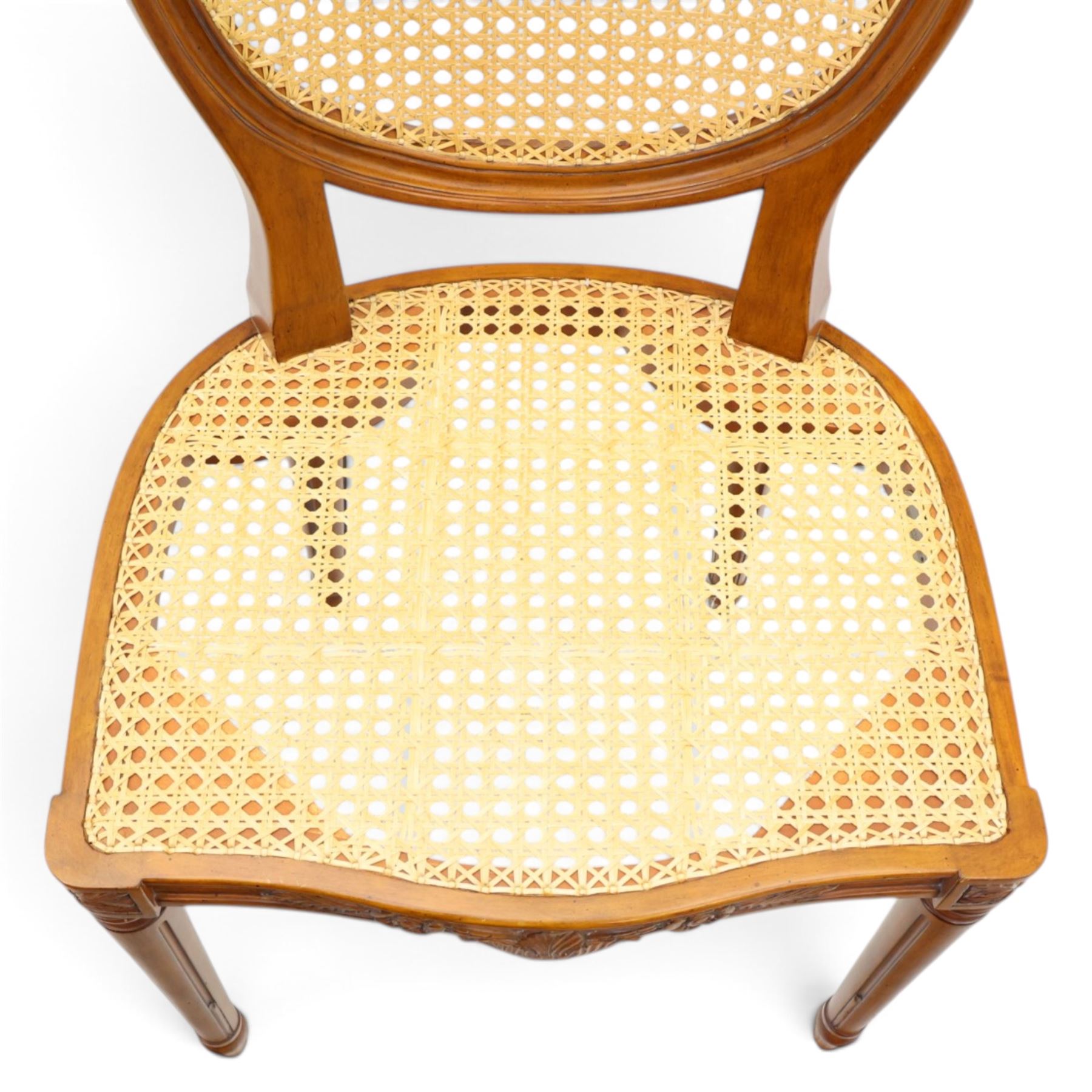 And So To Bed - French design 'Floral Caned Chair', balloon caned back with foliate carving, above a caned serpentine seat, reeded and turned supports