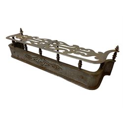 Victorian steel fire fender, the shaped open fretwork top in a scrolled design, raised on turned spindle supports, the base decorated with applied steel detail