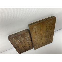 Two wooden biscuit moulds, carved loving spoon and fork, and two bradawls 