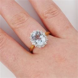 18ct white gold aquamarine and diamond cluster ring, single oval cut aquamarine of approx 2.30 carat, surrounded by fourteen round brilliant cut diamonds, London 2022, total diamond weight approx 0.45 carat