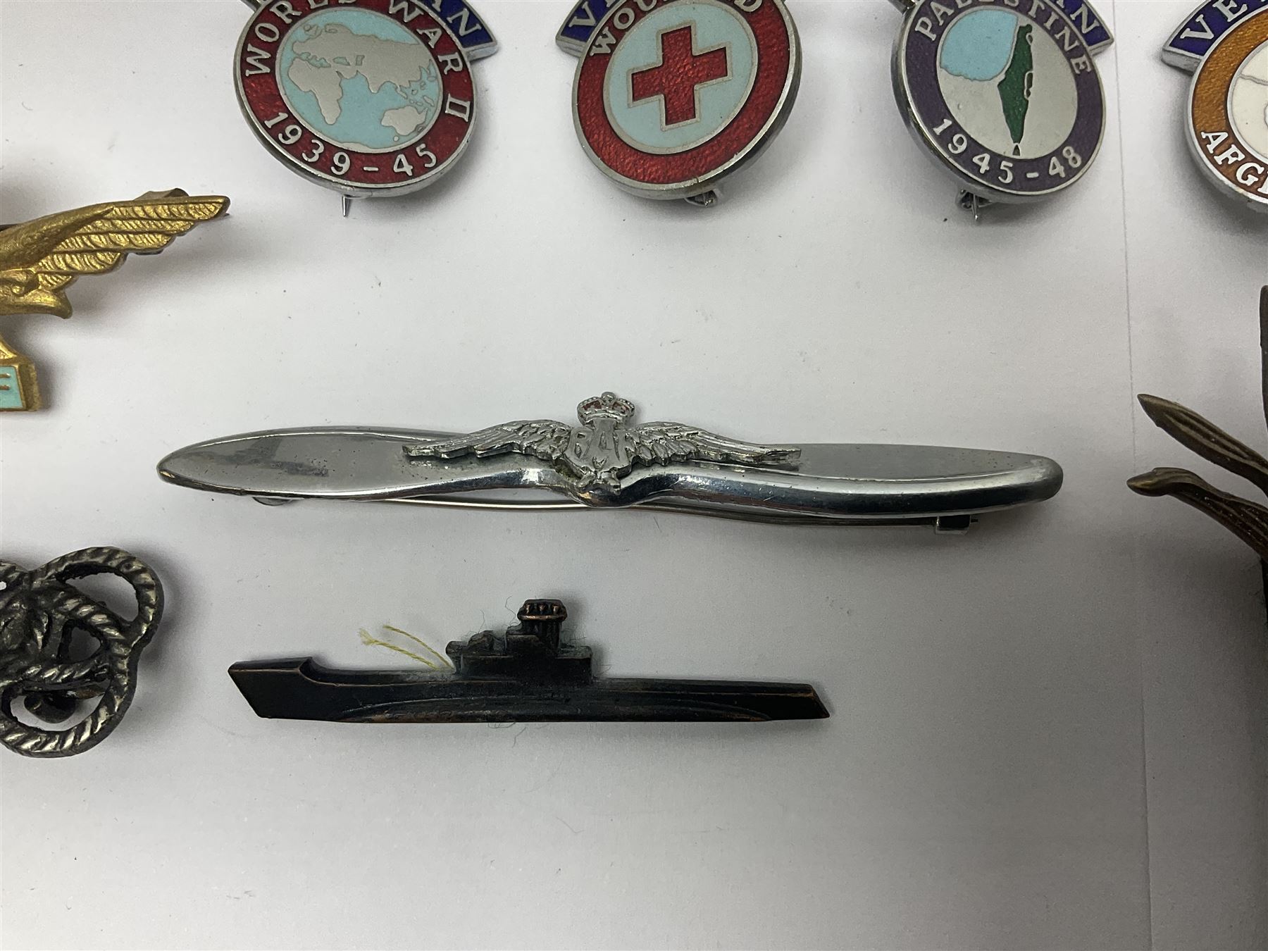 Two Edwardian hallmarked silver presentation fobs for military bugling competitions; and quantity of cap/glengarry and other badges, sweetheart brooches etc