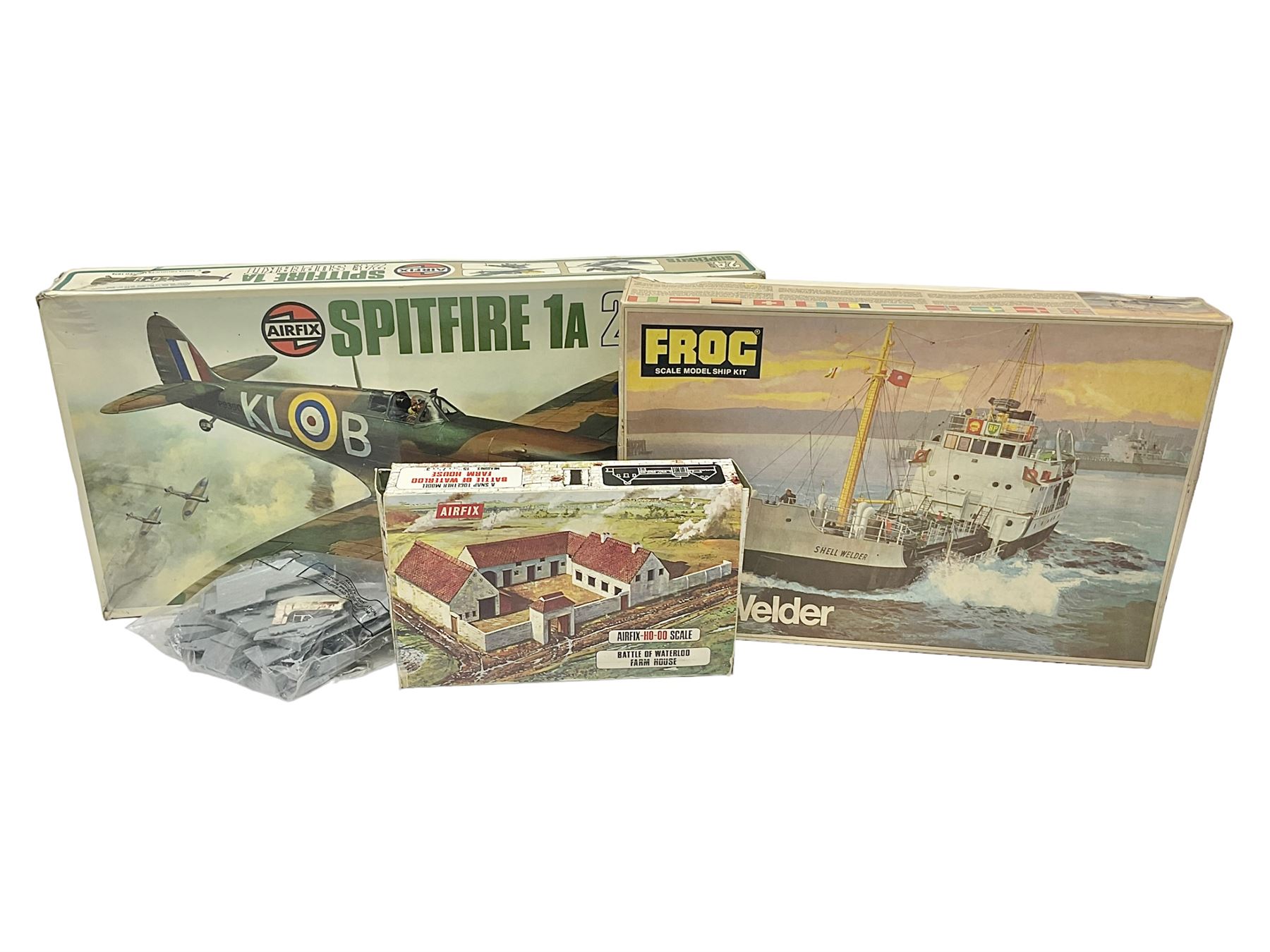 Three unmade construction kits - Airfix 1:24 scale Supermarine Spitfire Mk.1A; predominantly in unopened factory packaging with instructions and decal sheet; Frog Shell Welder with instructions; and Airfix Battle of Waterloo Farmhouse (instructions on box base); all boxed (3)