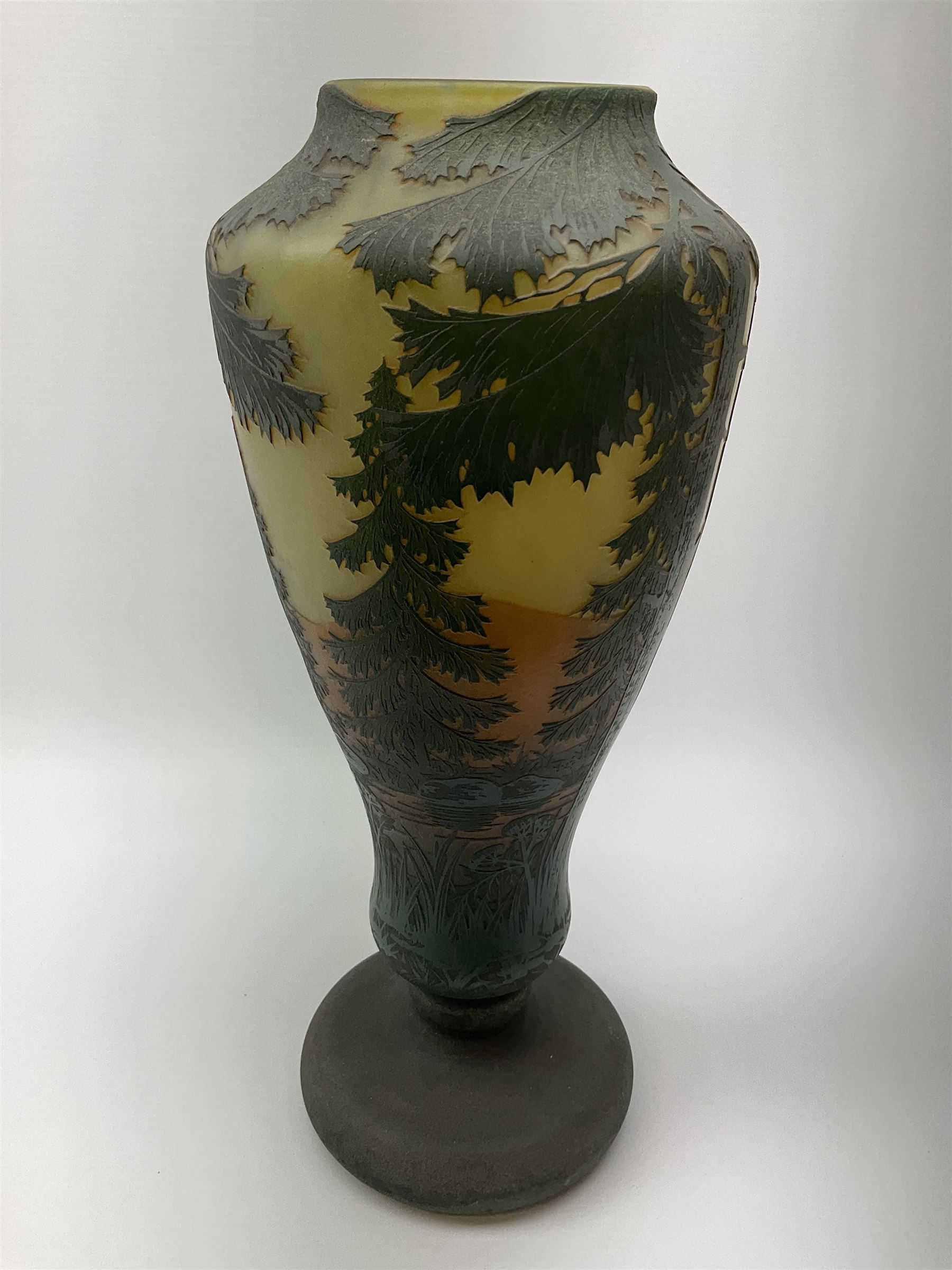 Reproduction Daum Nancy art nouveau  style overlay and cut glass vase in ovoid form with a circular base, decorated with woodland and mountain scene, H38.5cm. 